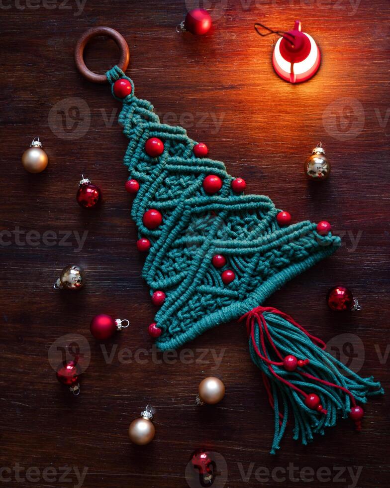 Christmas decoration macrame tree on the table top view photo