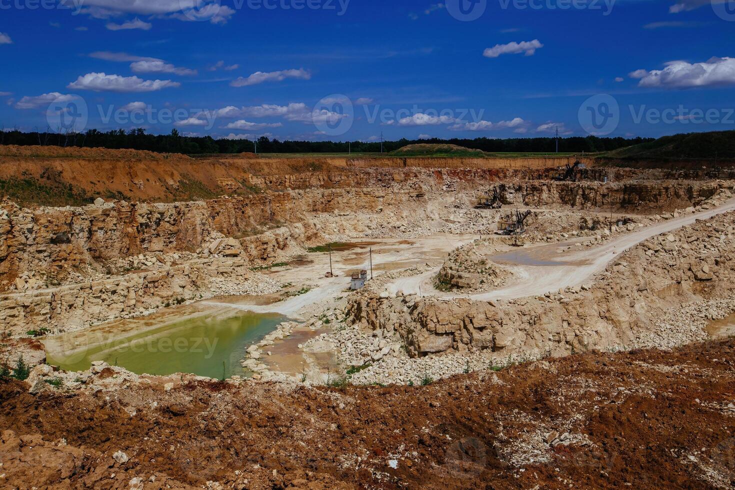 Excavators working limestone mining in quarry photo