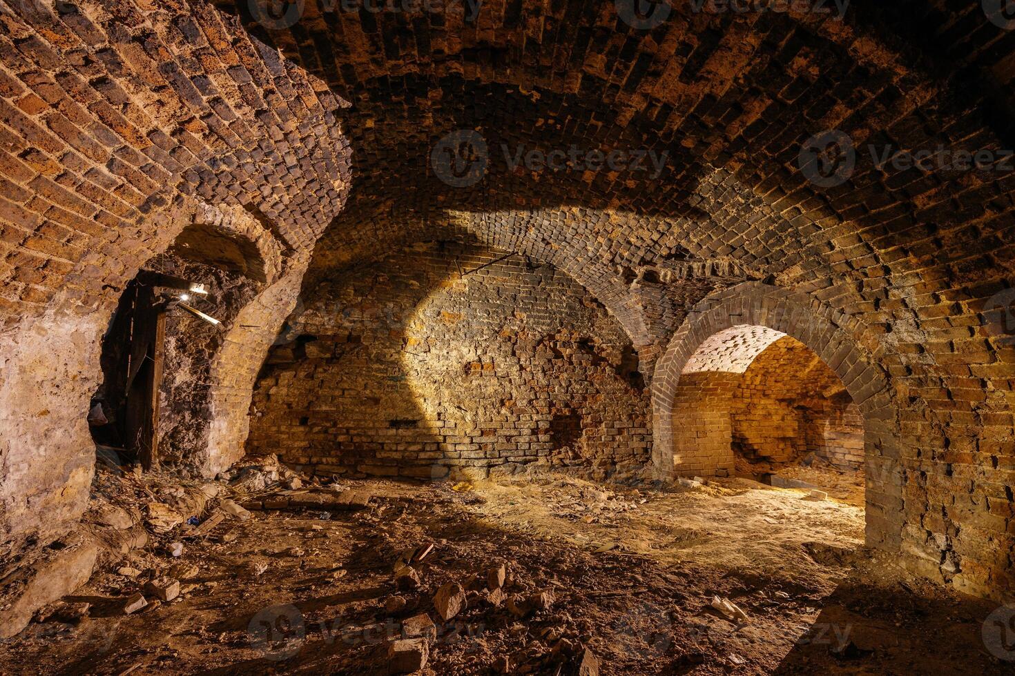 Abandoned empty old dark underground vaulted cellar... photo