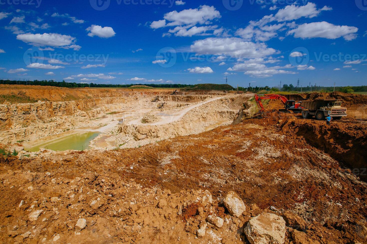 Excavators working on limestone mining photo