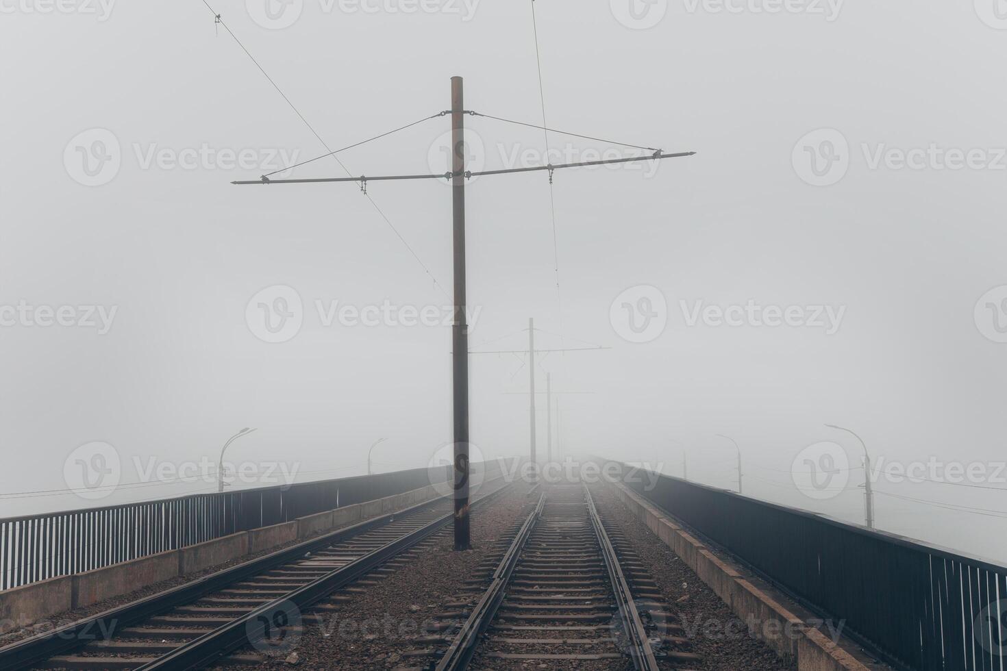 Foggy railway bridge, railroad tracks photo