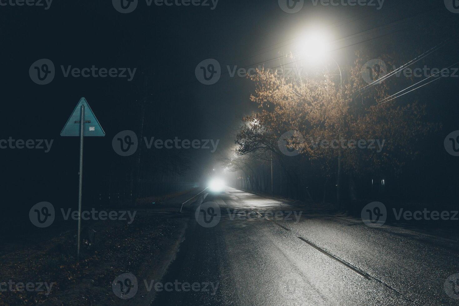 Foggy misty street at night. photo