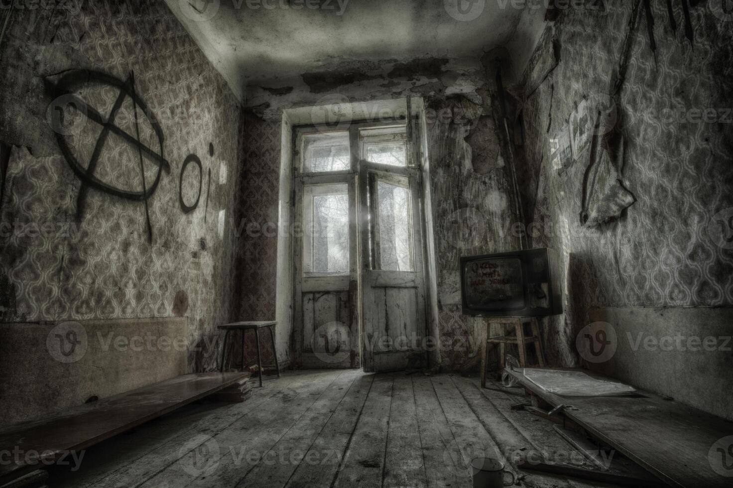 Creepy broken television in dirty room photo