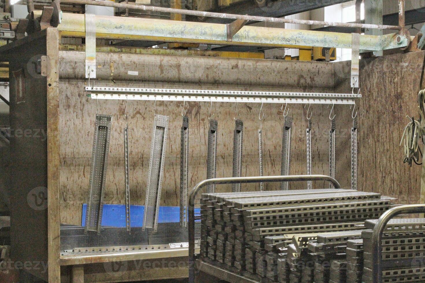 Close-up of a factory interior, industrial equipment and machinery. Complexity of modern manufacturing, network of pipes, tanks, and structures. Concept of industry, production or technology photo