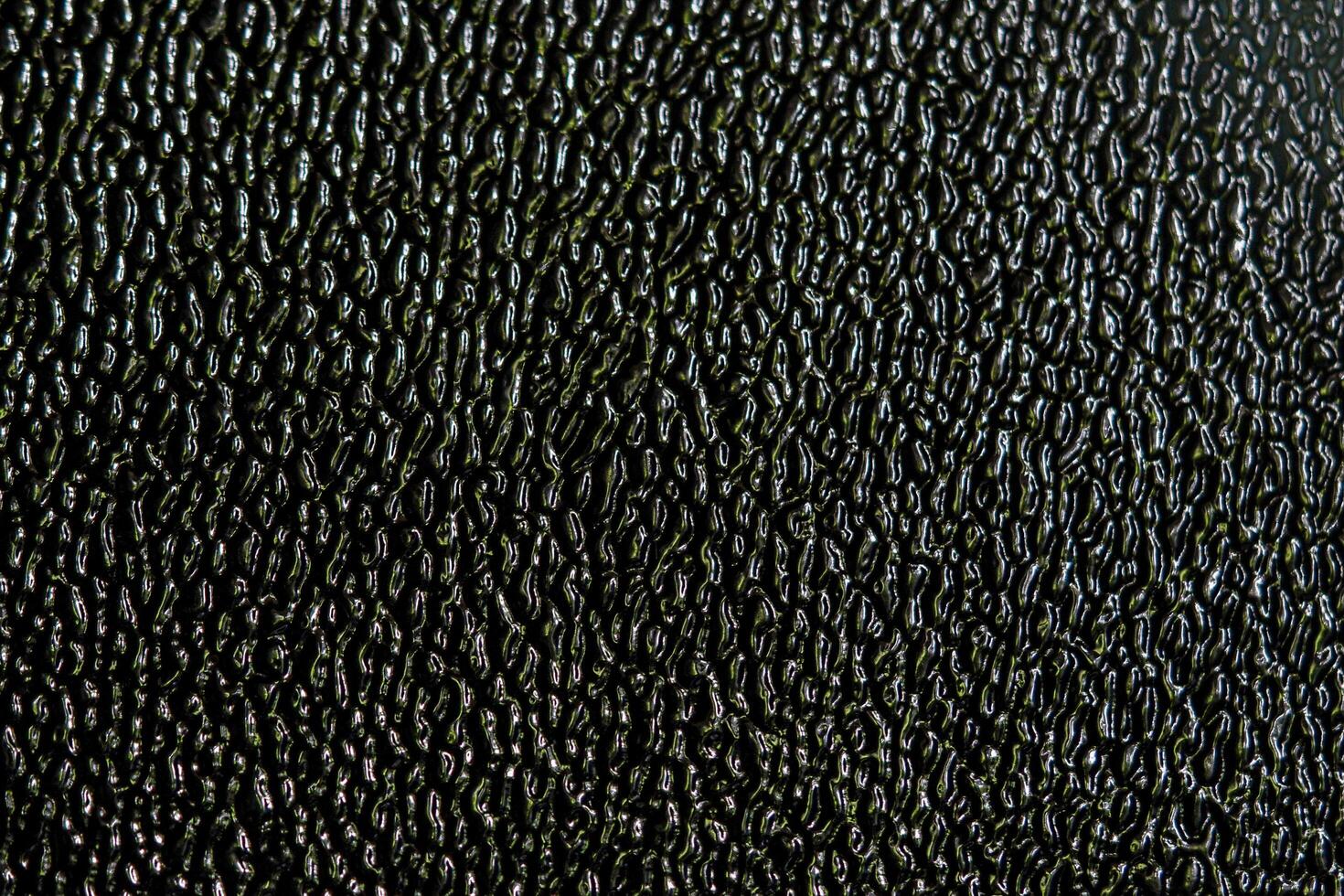 A black surface with a texture photo