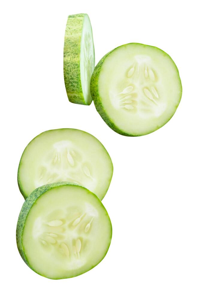 Fresh green cucumber slices in circle shape in stack isolated on white background with clipping path photo