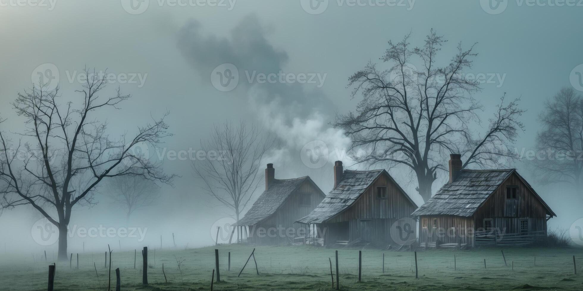 Misty morning in a serene countryside with wooden houses and bare trees. photo