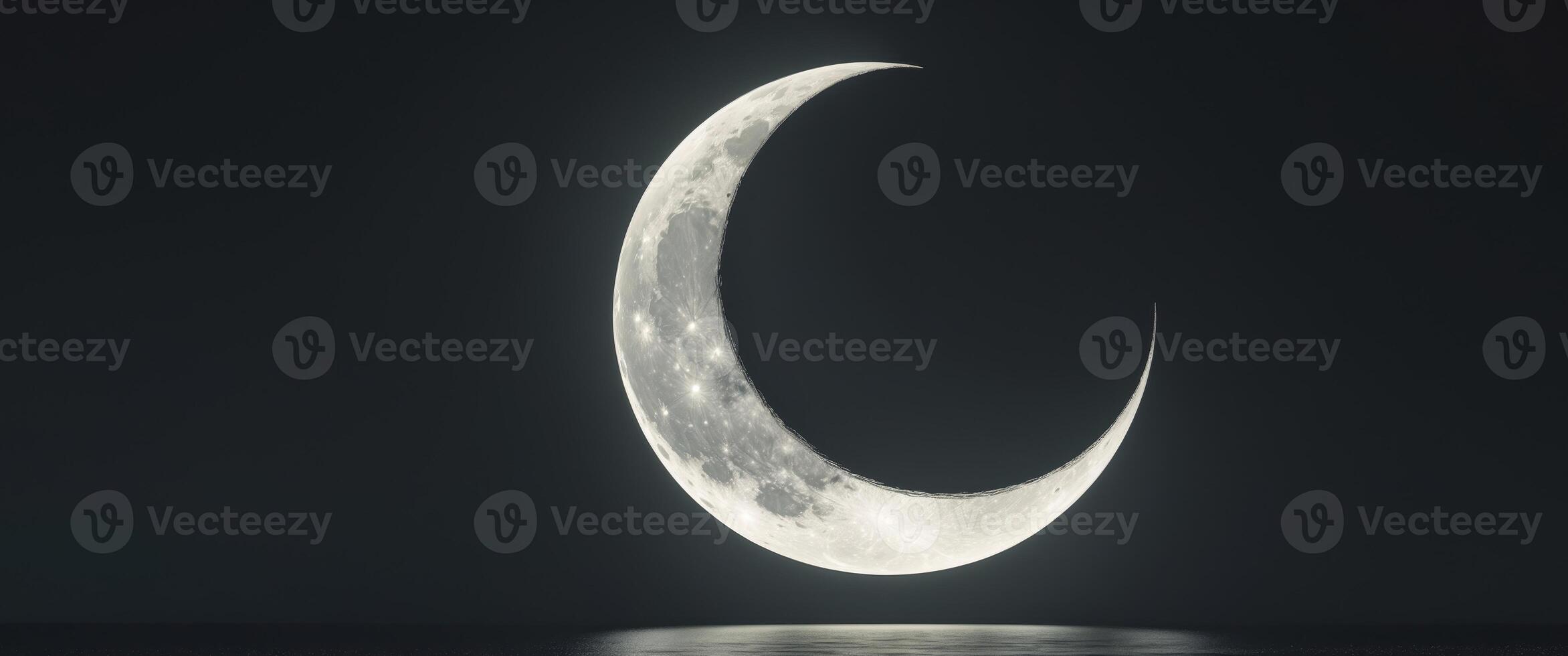 Beautiful Crescent Moon with Dark Backdrop. photo