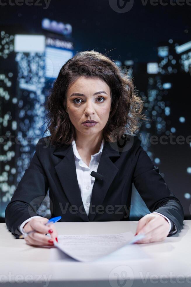 Night show host presenting latest events with details, covering all important topics of the day. Woman working as news anchjor broadcasting live information, public interest stories on tv channel. photo