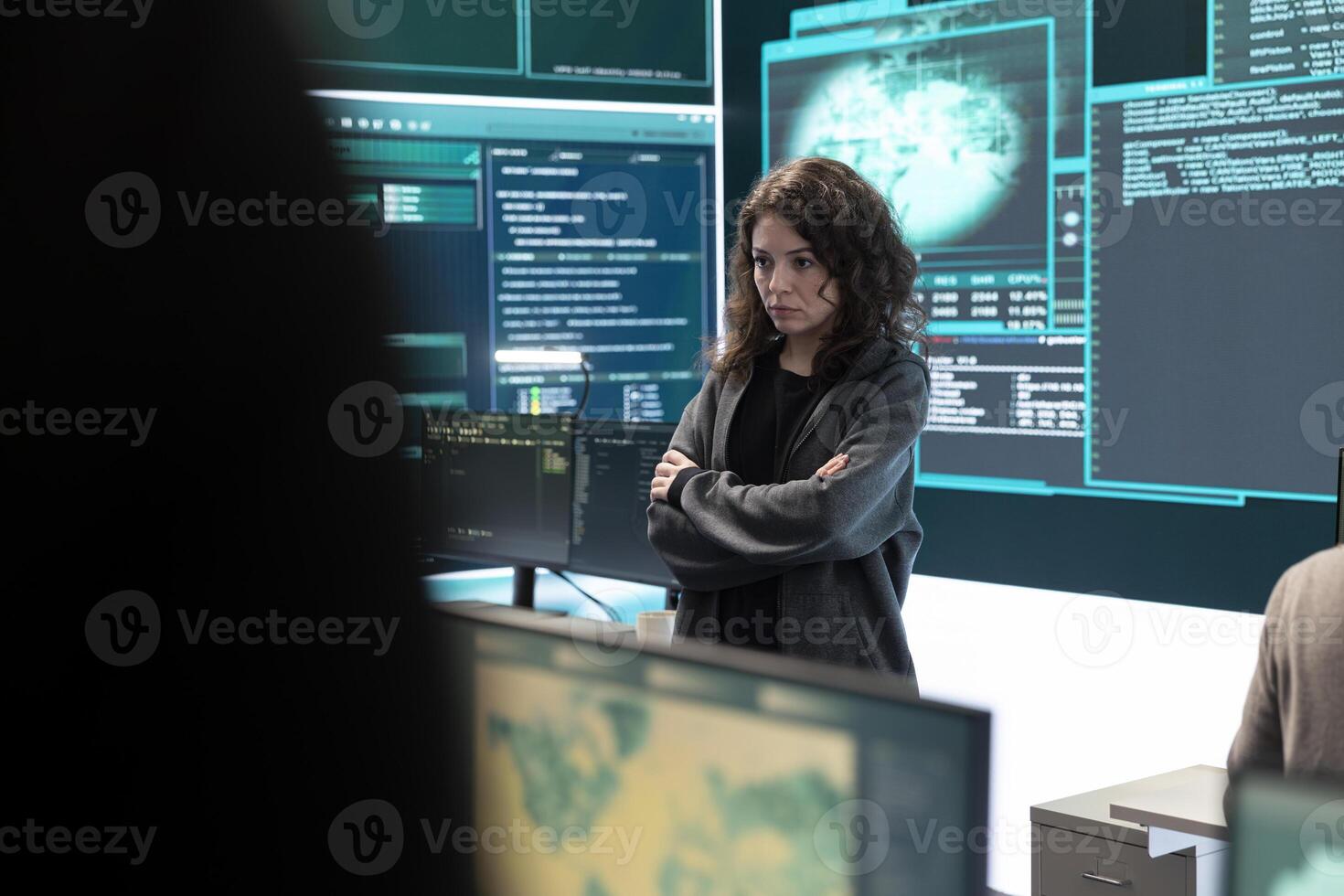 Cyber security expert in a national safety operations center detecting cyber attacks or threats. Governmental hacking team focusing on data protection, cyber operations in progress. photo
