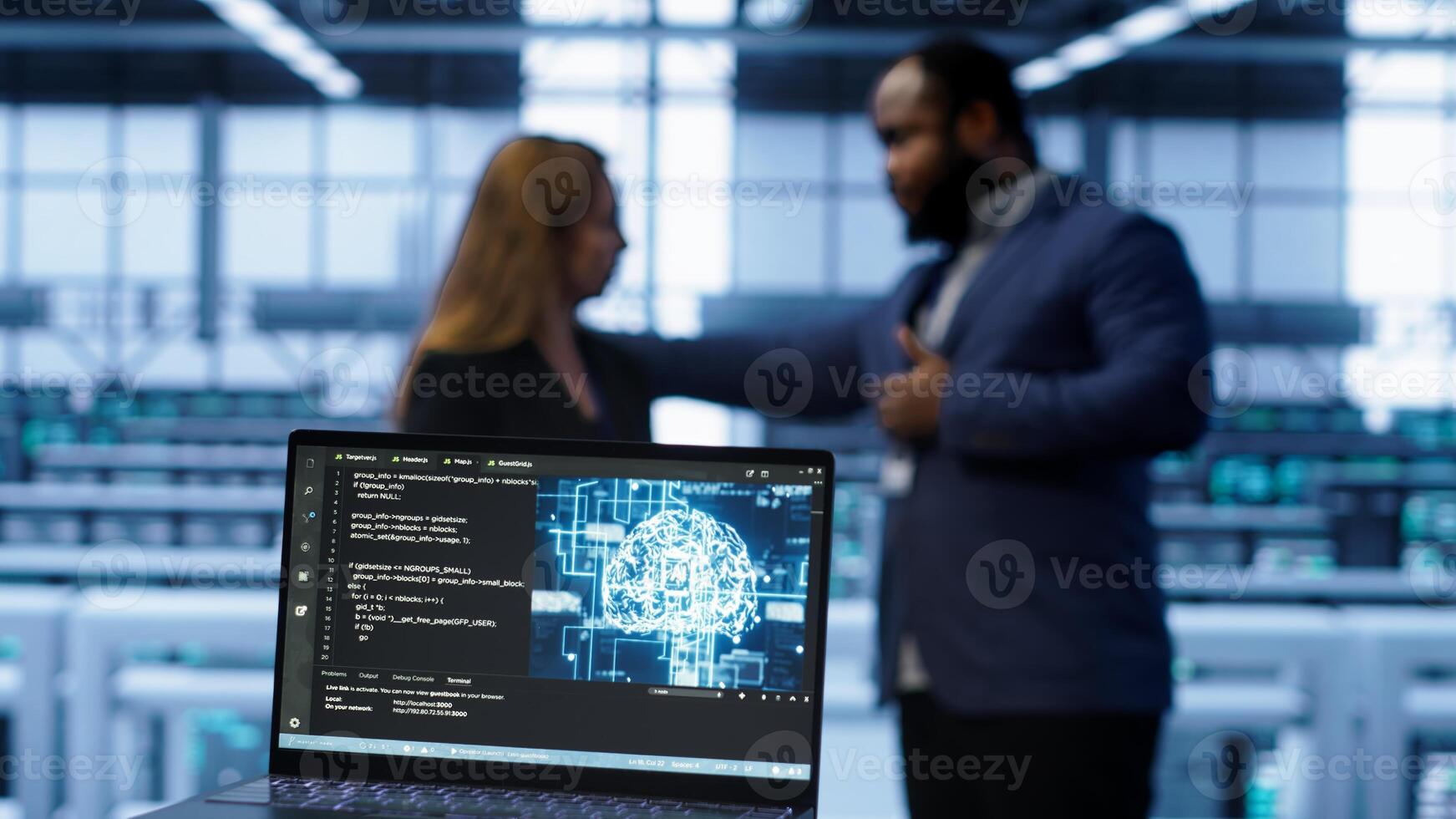 Close up of laptop with AI technology used to sustain data center hardware. Focus on notebook used by server room programmers in background using artificial intelligence tech, camera A photo
