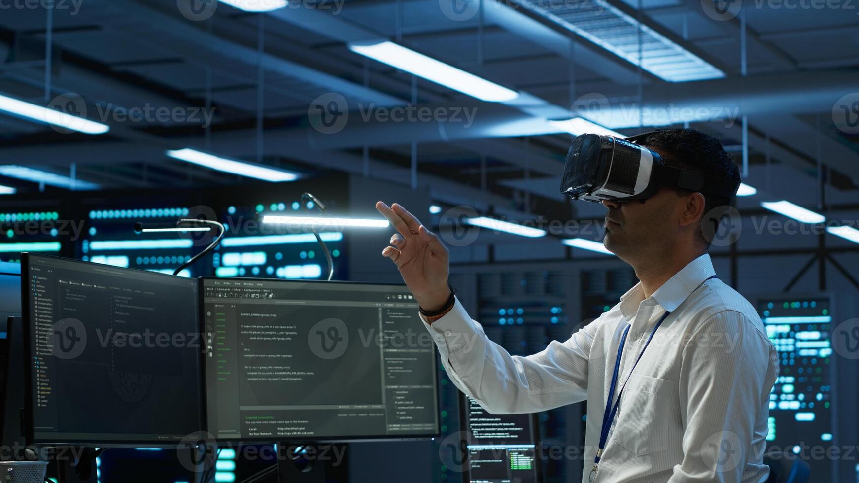 Engineer wearing VR headset in data center installing software on computer, troubleshooting issues. IT expert in server hub using virtual reality tech, establishing performance benchmarks, camera A photo