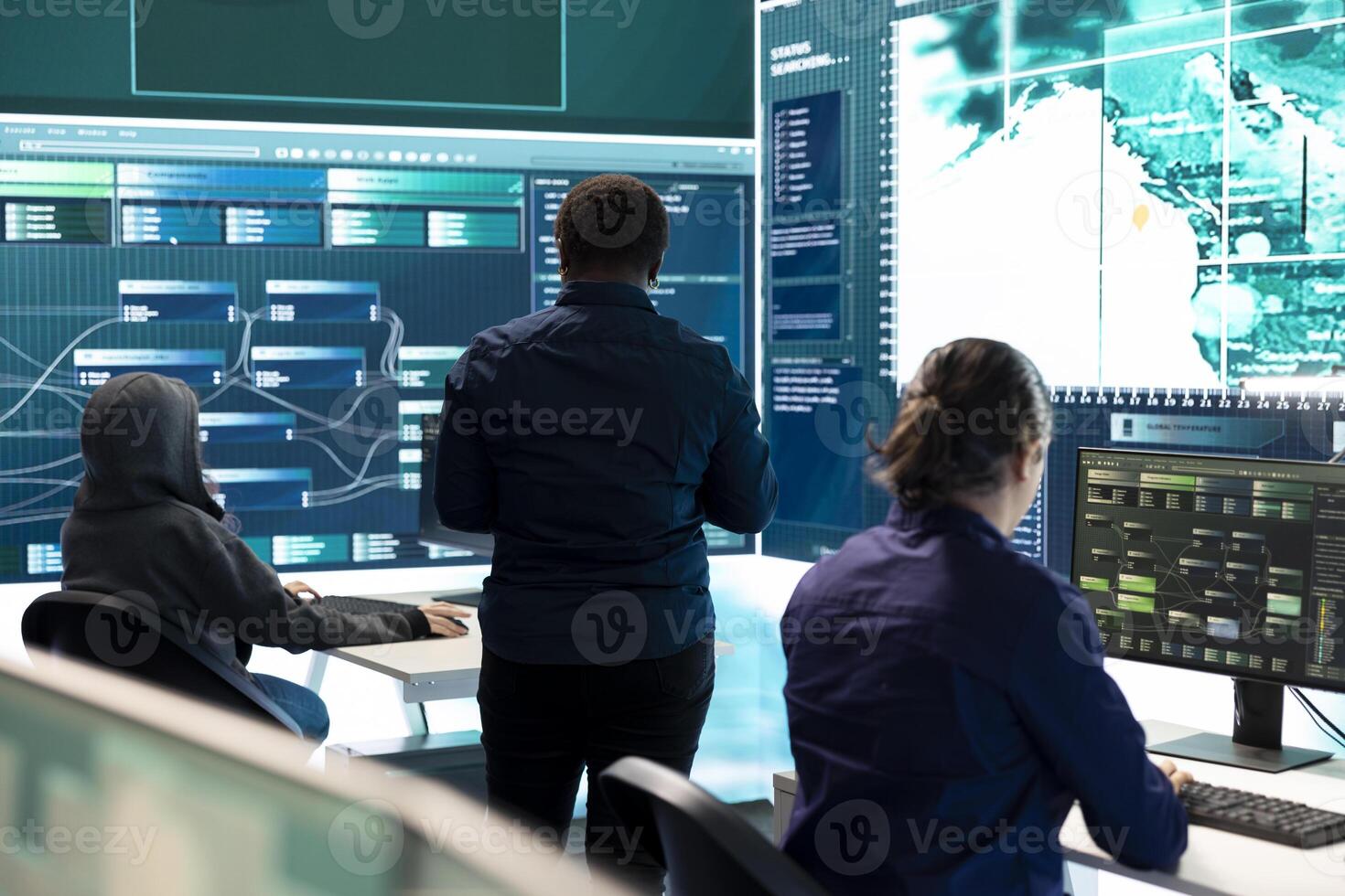 Governmental hackers exploiting network systems in high tech office, executing cyber operations for national server security. Focus on data protection and online safety to combat cybercrime. photo