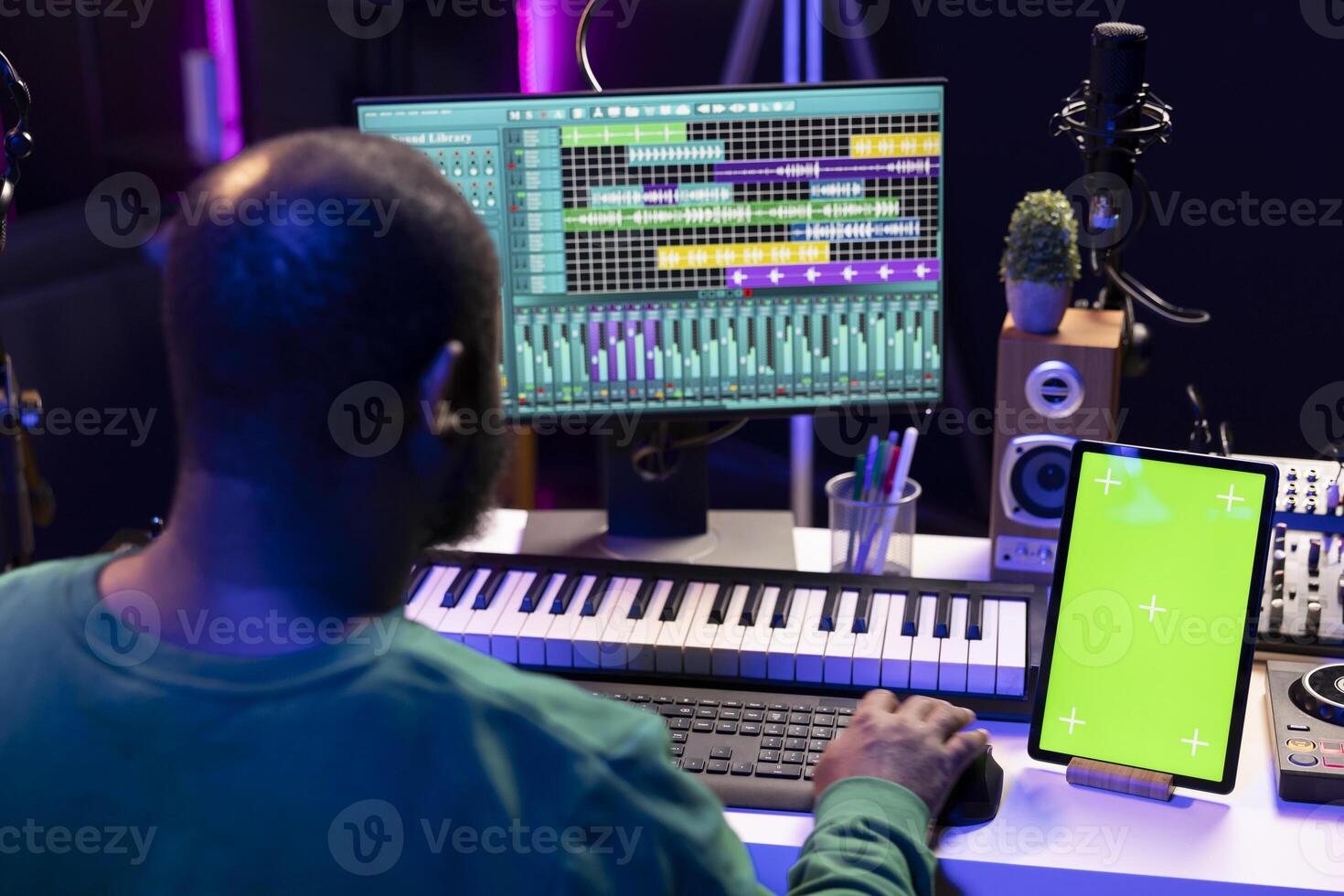 Artist producer creating new music with mix and master techniques, using a screen with copyspace layout. Skilled audio engineer editing tracks in post production, digital audio software. photo