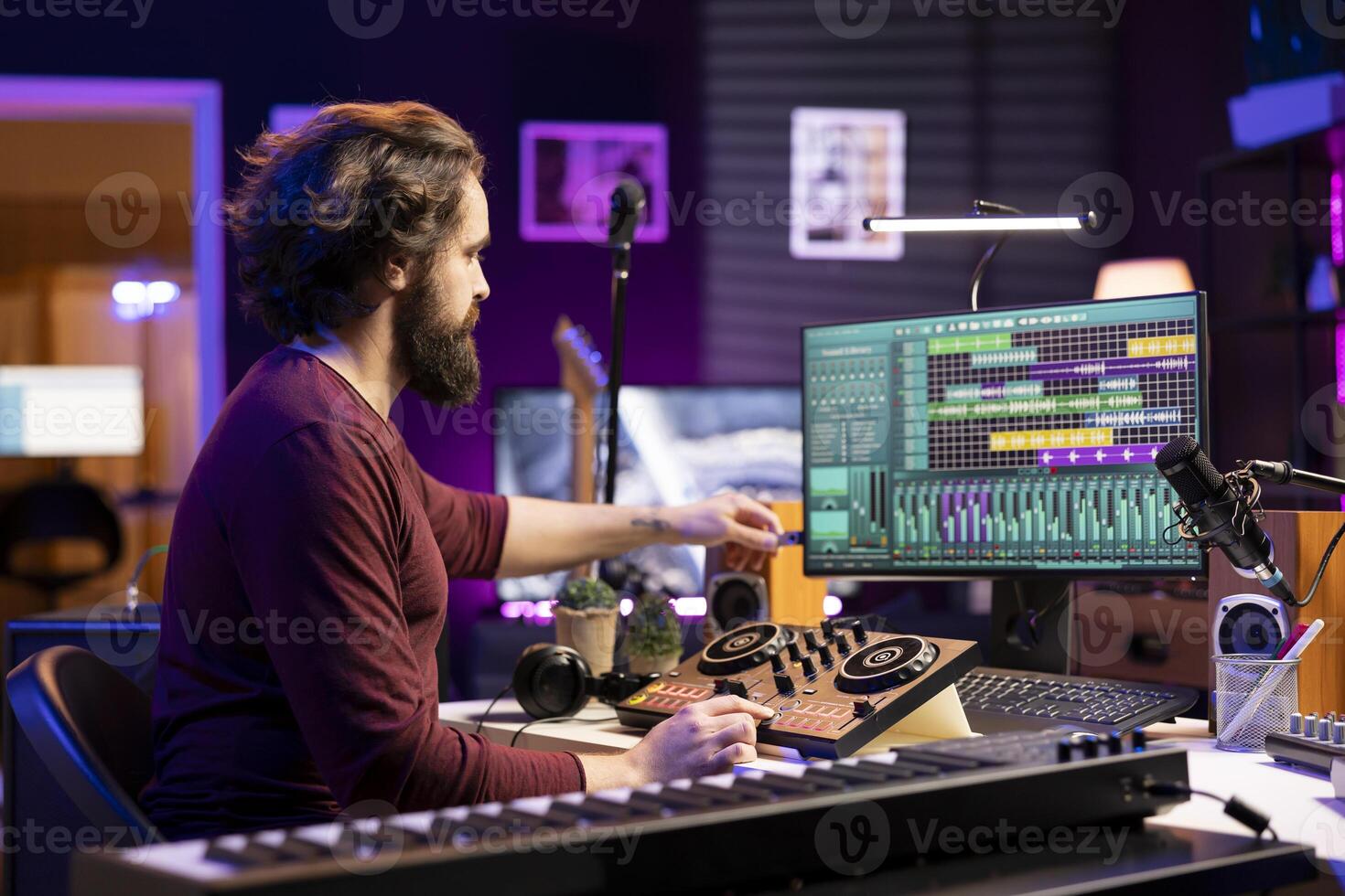 Music producer creating new music with an usb stick in home studio, editing tracks from old audio recordings. Young songwriter composer mixing and mastering tunes, daw software on computer. photo