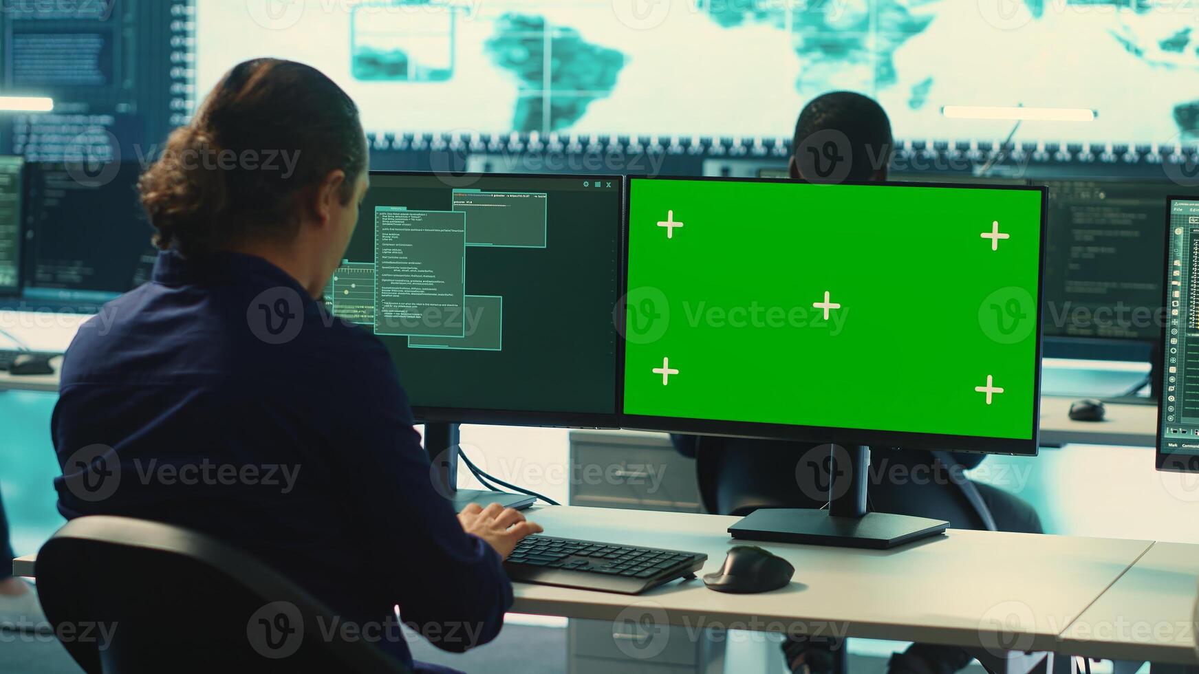 Governmental hackers using green screen in performing cyber security monitoring and threat detection. Examining network security and protection against cyber attacks, national intelligence. Camera A. photo
