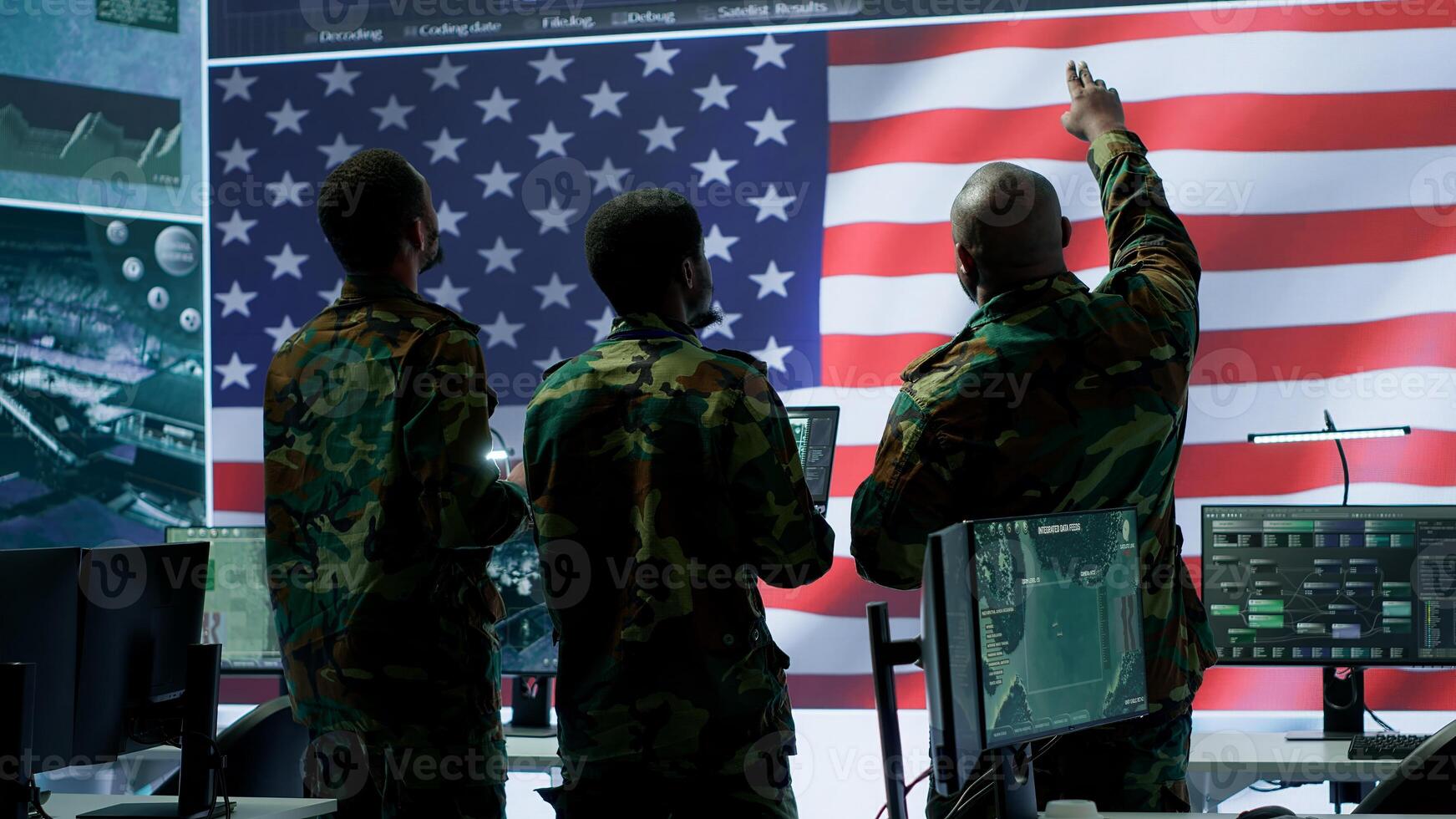 Military personnel work in a high tech environment safeguarding classified data and managing cybersecurity operations to defend against cyber attacks and digital warfare threats. Camera A. photo