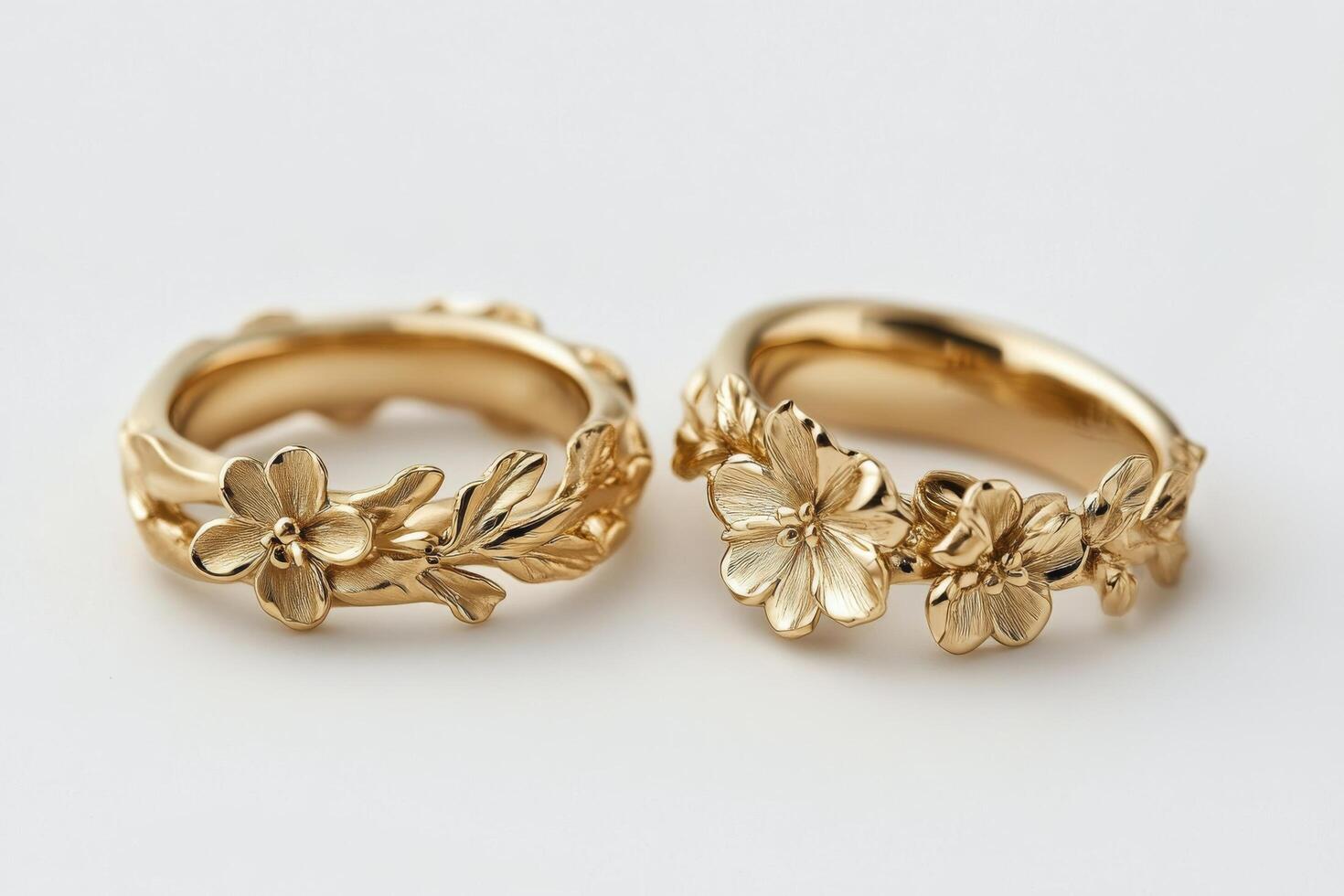 Two gold rings with flowers on them photo
