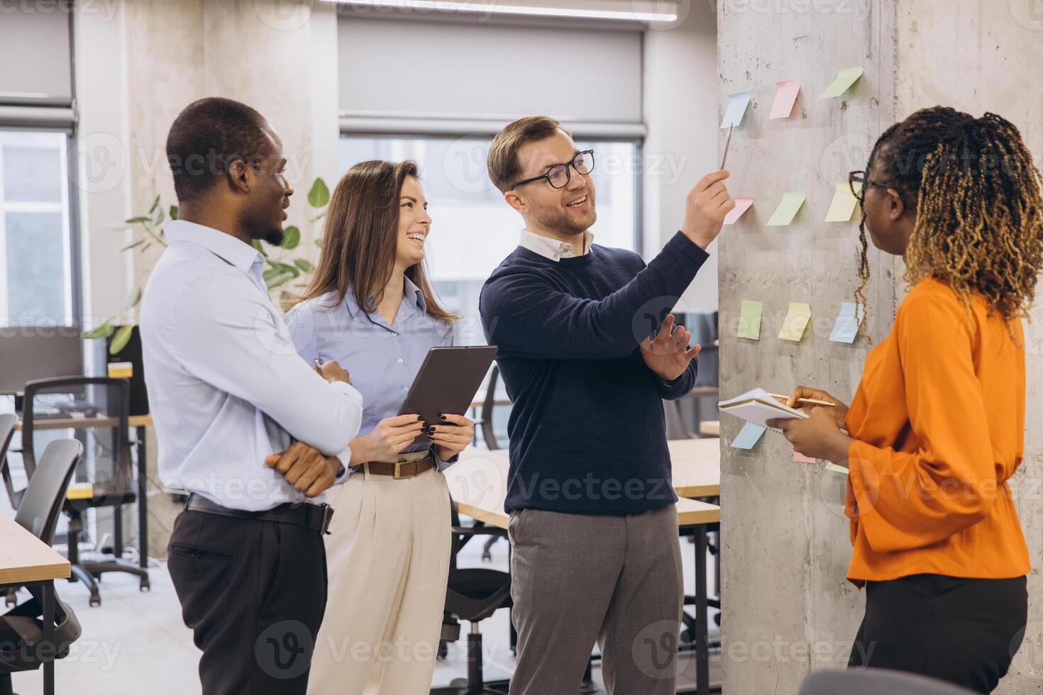 Business colleagues collaborating and sharing ideas during a productive meeting in a contemporary workspace photo