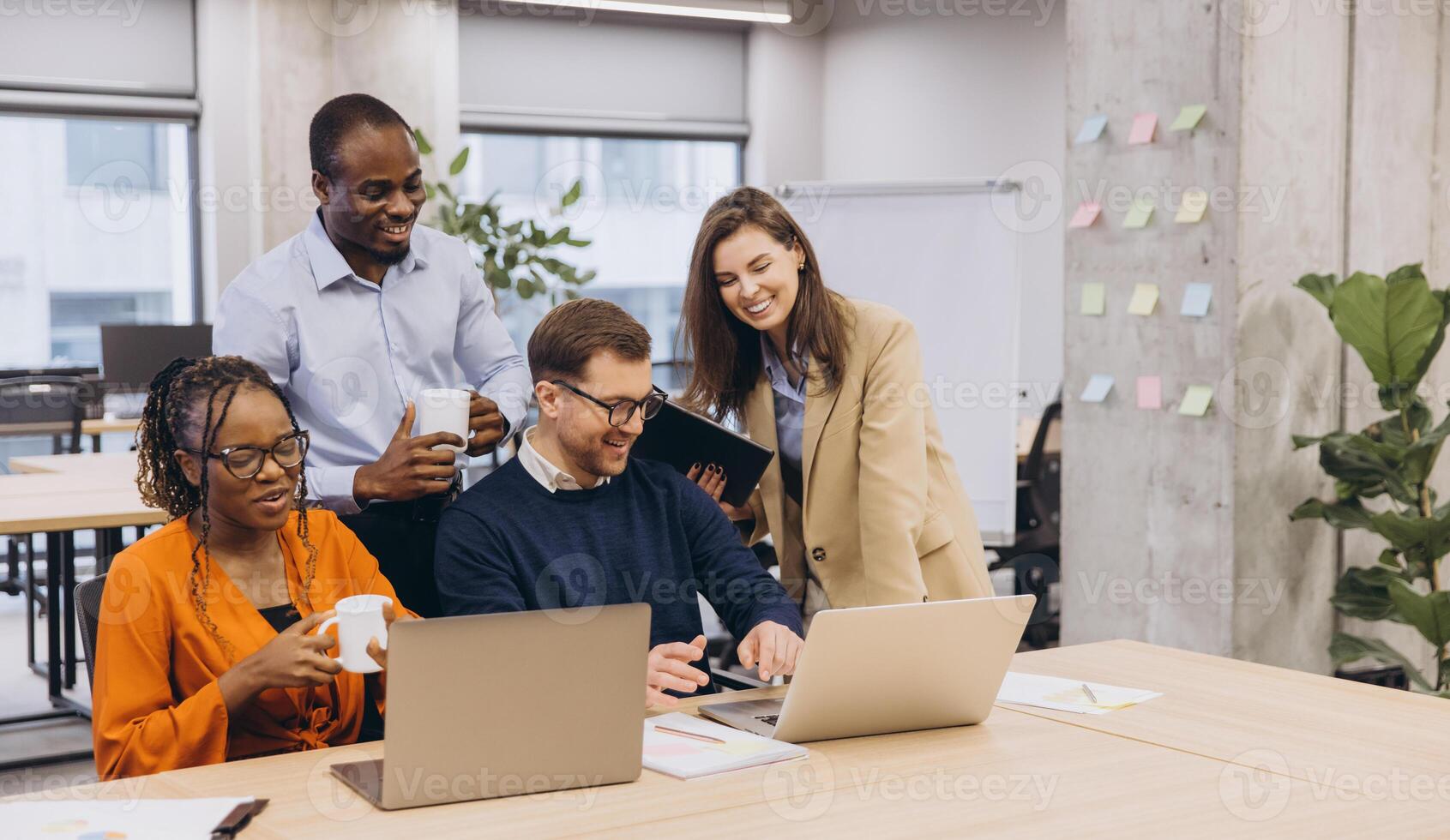 Professionals collaborating during brainstorming meeting, sharing ideas in contemporary workspace with diverse team members working together photo