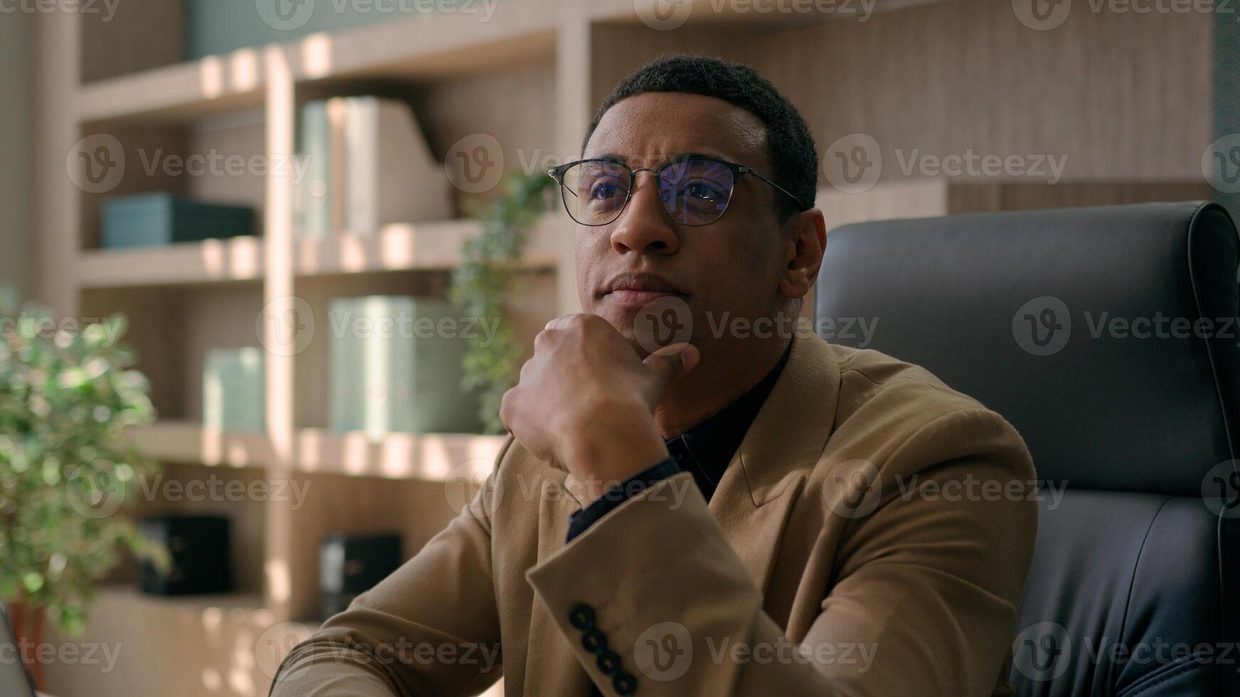 Close up thoughtful male businessman puzzled ethnic man think difficult question business problem solution at office workplace pensive employer manager CEO thinking ponder deep thoughts consider doubt photo