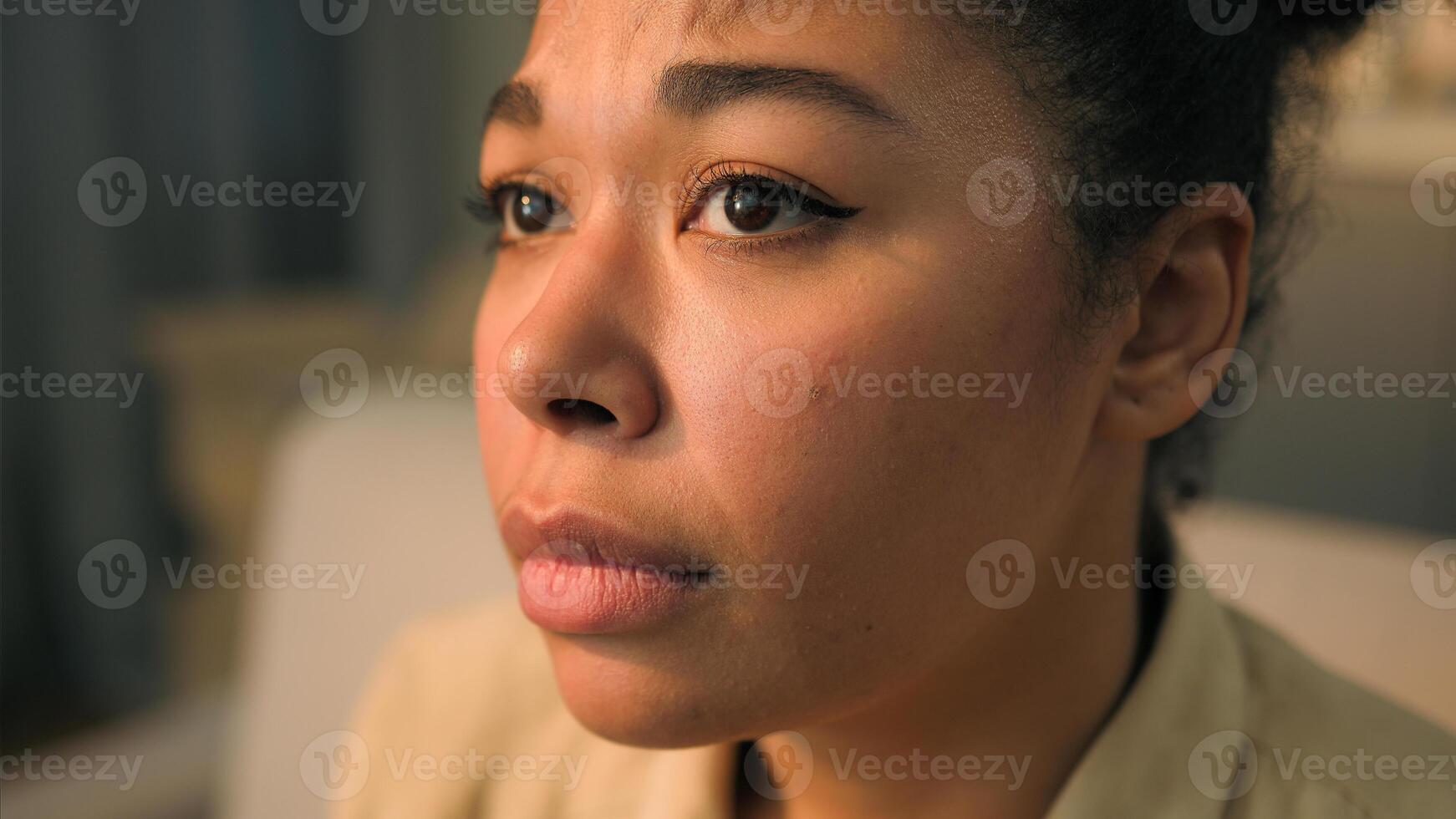 Close up face African American woman disappointed upset alone sorrowful ethnic girl female lady homeowner think problem ponder upset suffer depression worried frustrated grief health trouble at home photo