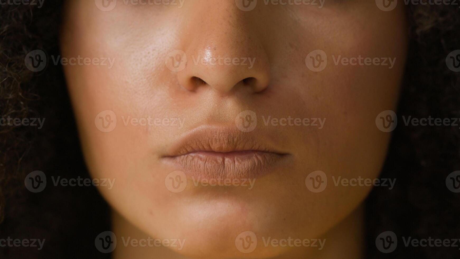 Female beautiful young African American ethnic woman lady girl with curly hair healthy clean skin beauty skincare natural makeup cosmetics advertising close up face lips mouth businesswoman headshot photo