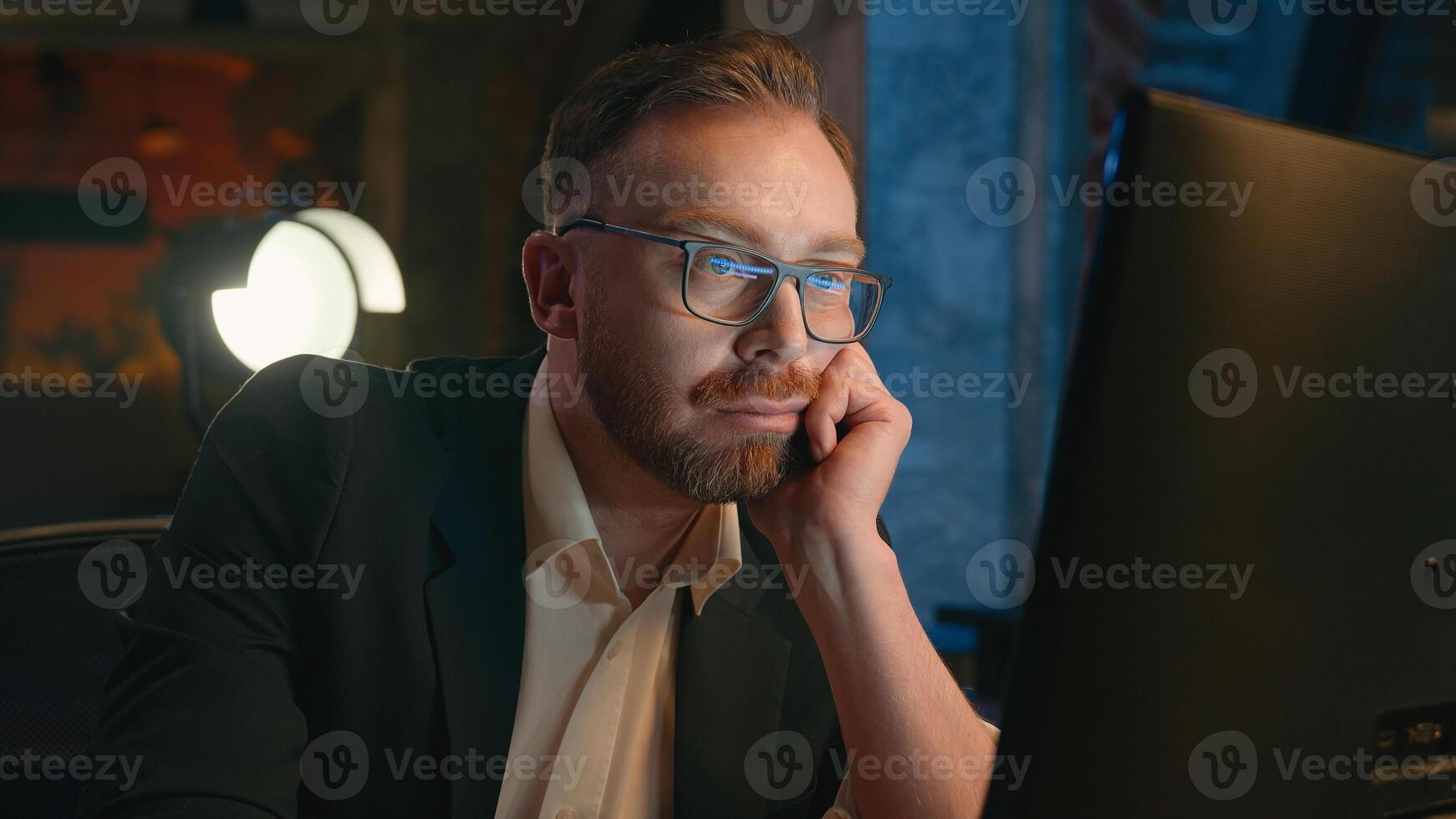 Tired exhausted fatigued late time boring working businessman stressed overworked Caucasian business man employer typing computer online guy male work at dark night office overtime insomnia deadline photo