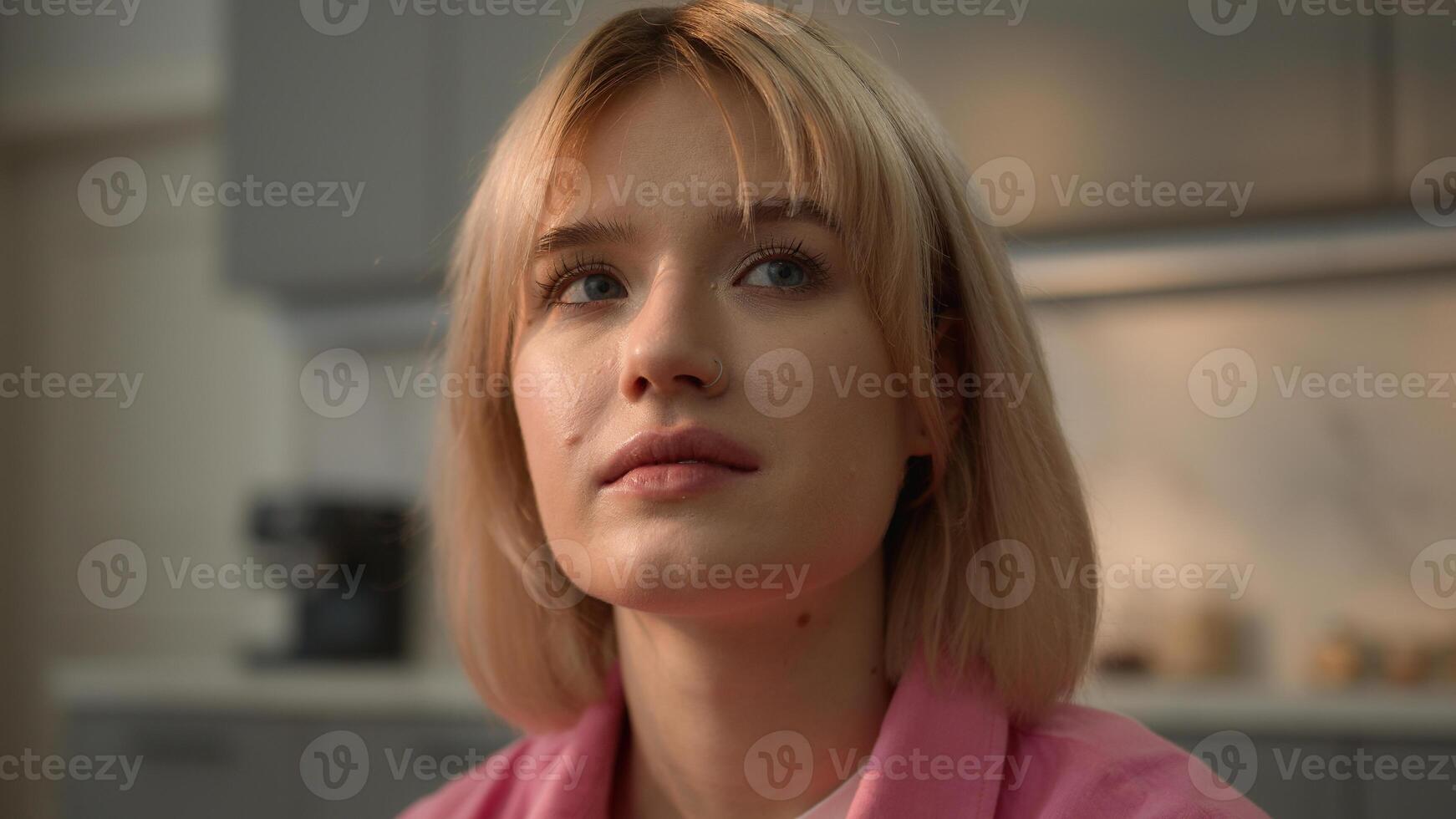 Close up portrait pensive contemplating serious calm alone lonely thoughtful thinking unwanted pregnant trouble problem health decision think Caucasian girl woman female at home looking away on couch photo