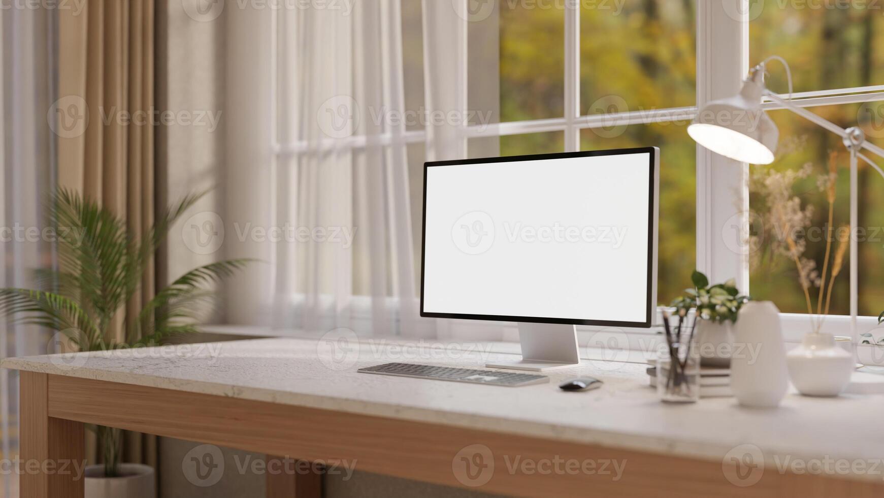 A computer and decorative items on a white marble desk, set against a window in a minimalist room. photo