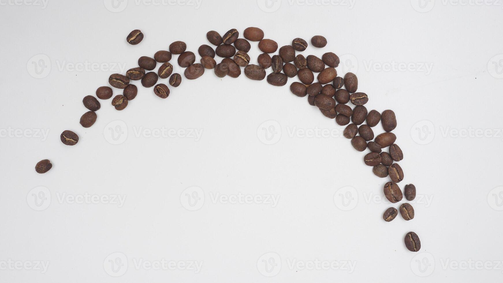 Top View of Half Circle of Coffee Beans on White Background photo