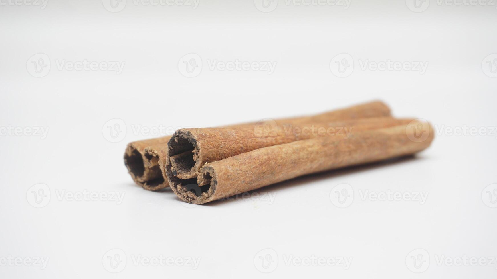 Two Cinnamon Sticks on White Background photo