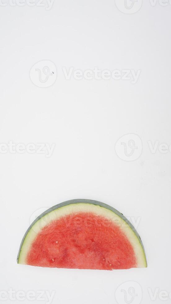 Slice of Fresh Watermelon on White Background photo