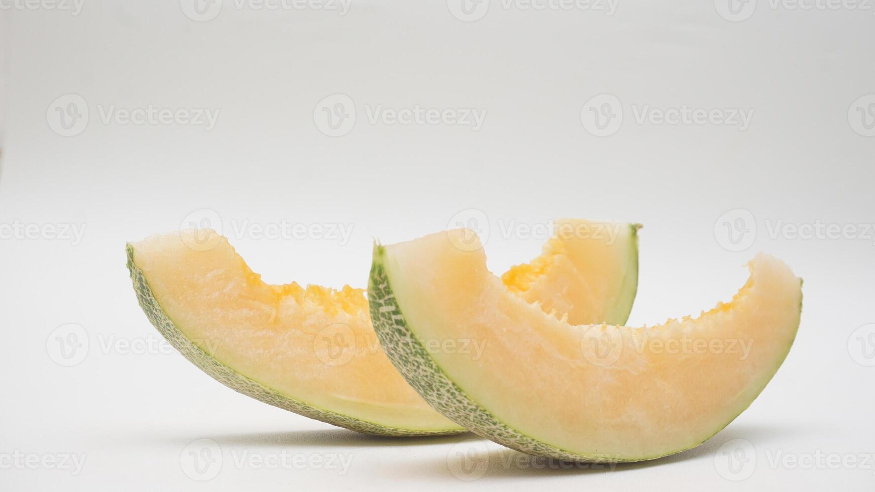 Two Slices of Cantaloupe Melon on White Background photo