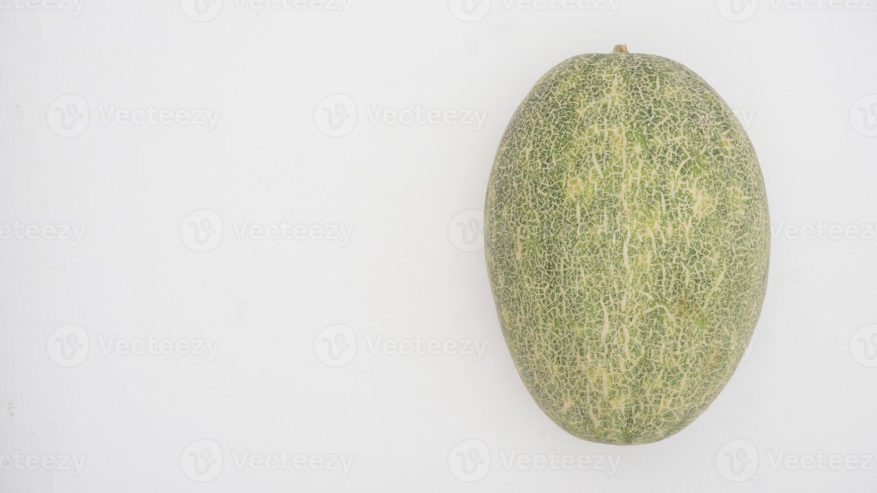 Oval Cantaloupe Melon with Copy Space Area on White Background photo