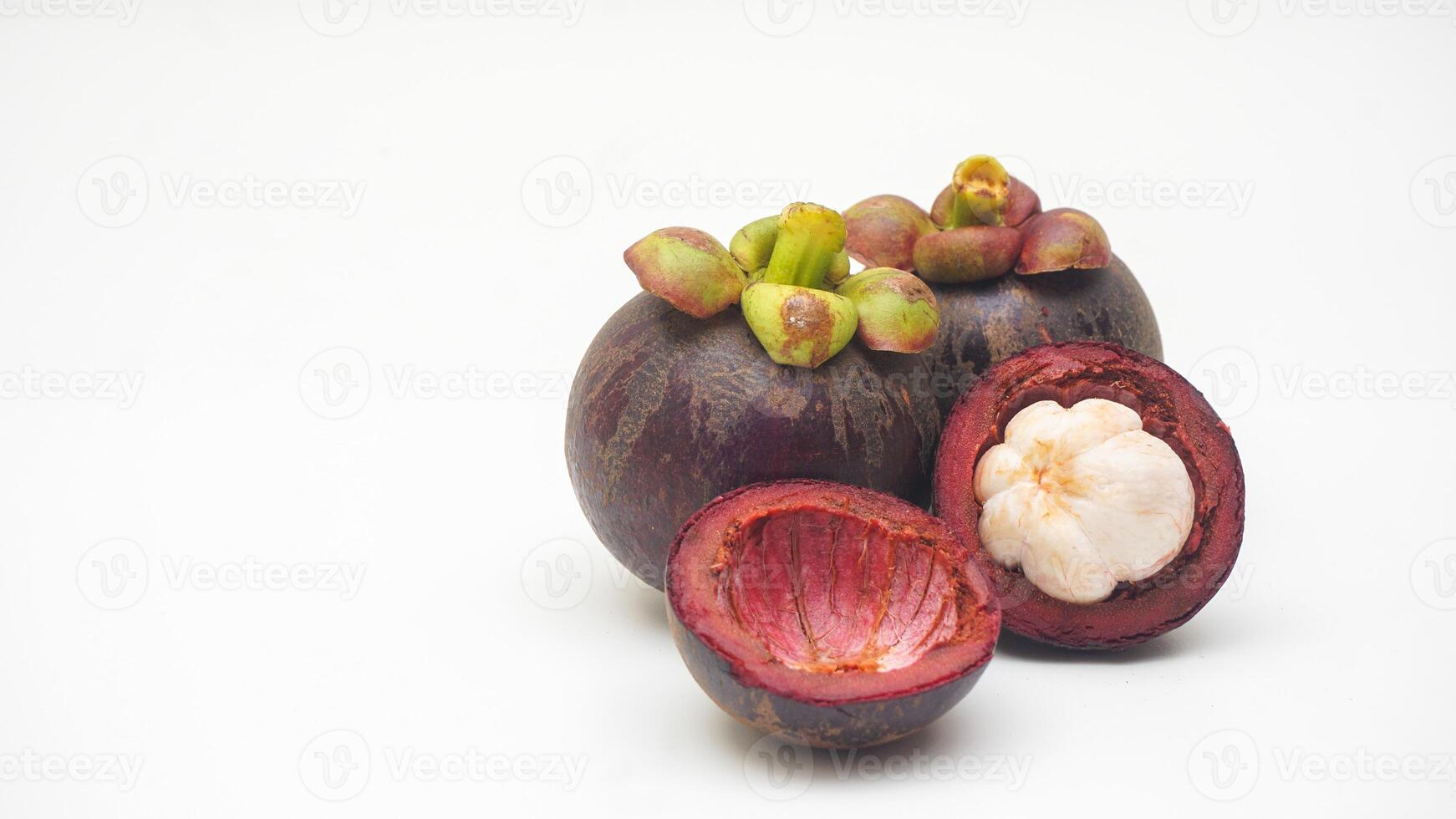Raw and Opened Mangosteen Fruit with Its Skin on White Background photo