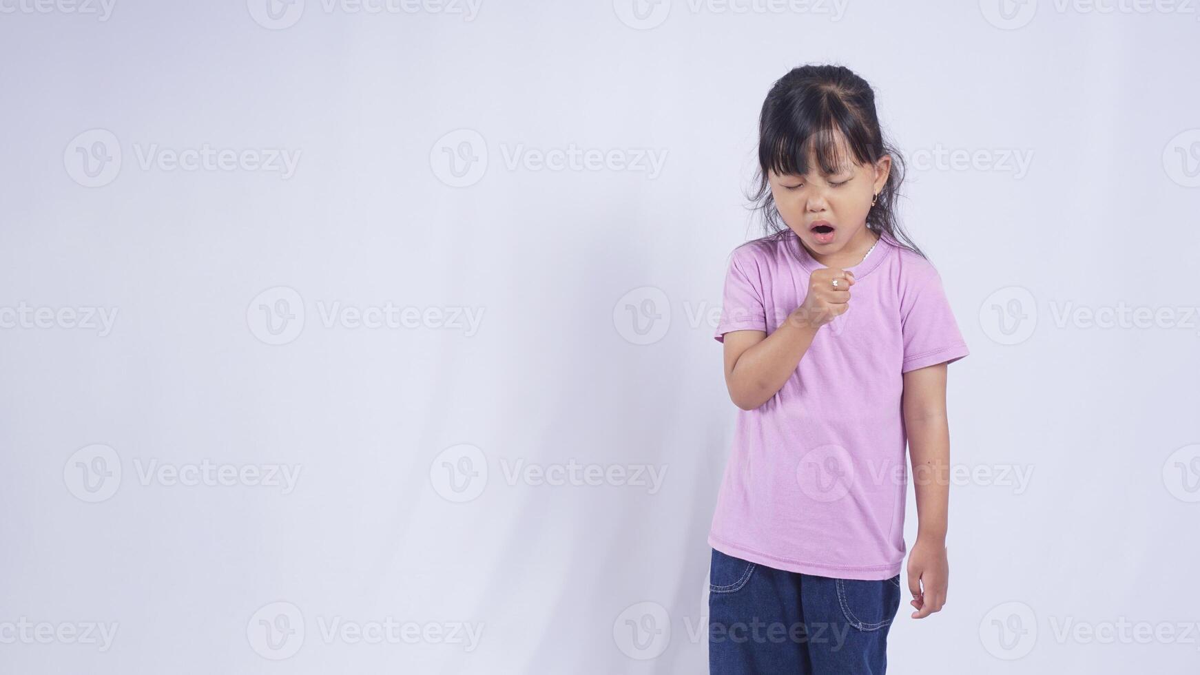 Asian Little Girl Coughing on White Background photo