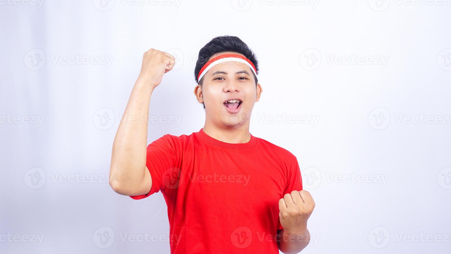 Indonesian Man with Red and White Ribbons Tied to His Head on White Background photo