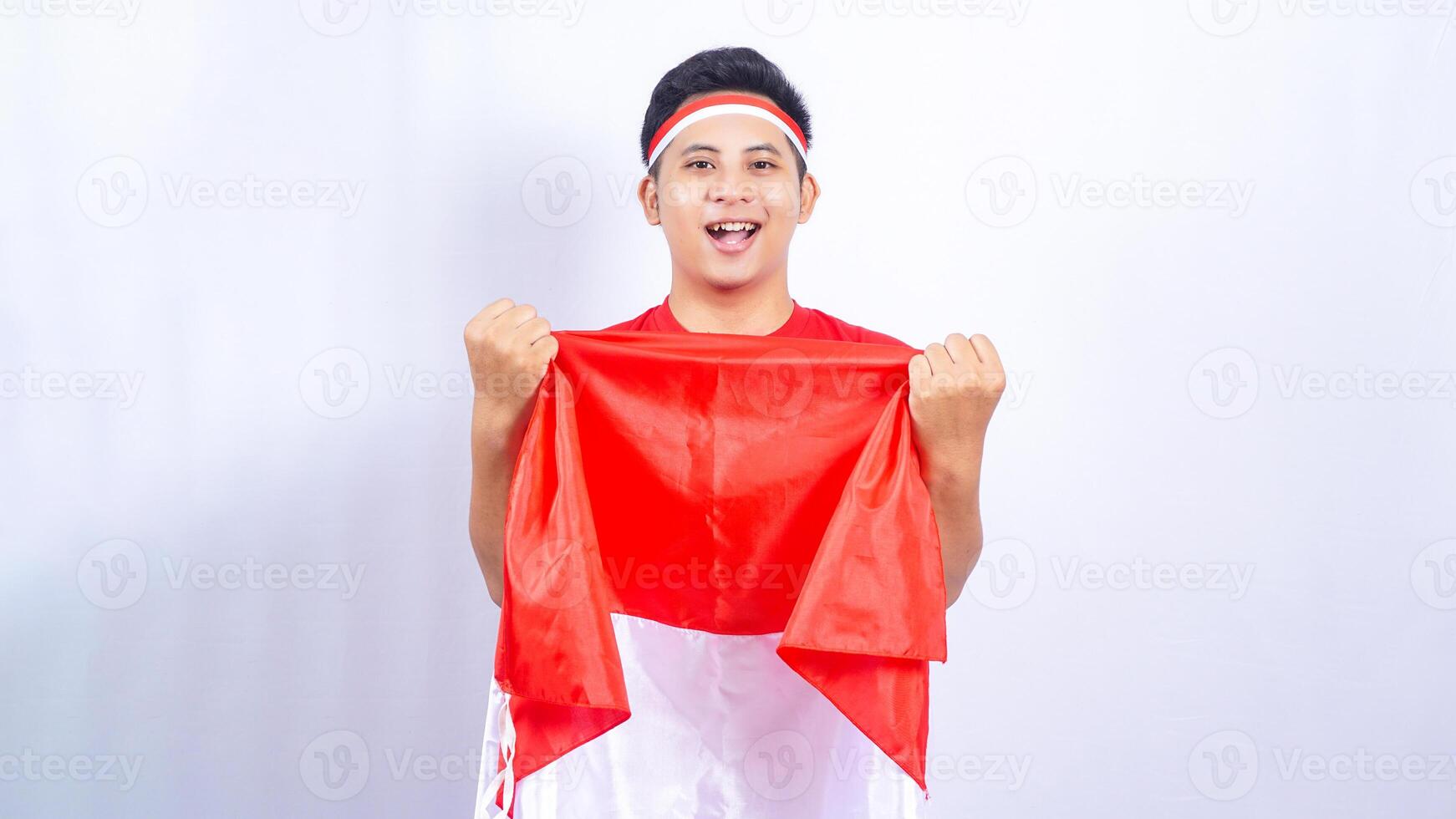 Indonesian Man Celebrating Independence Day of Indonesia on White Background photo