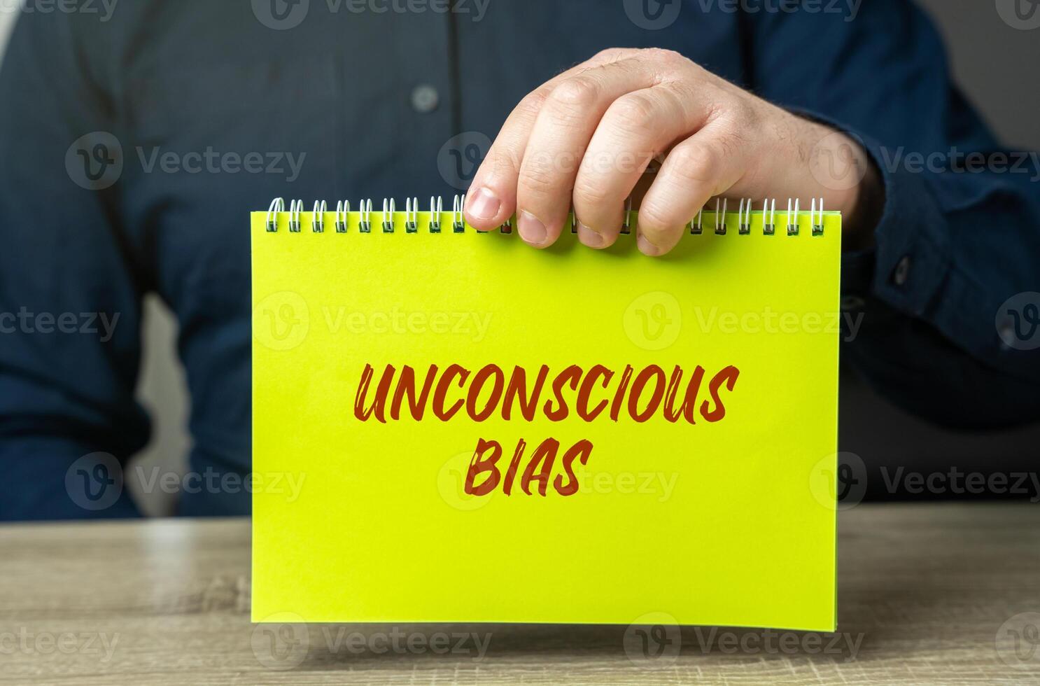 Unconscious bias concept - attitudes or stereotypes that affect our understanding, actions, and decisions in an unconscious manner. Implicit bias. Social norms or cultural influences. Man and notes photo