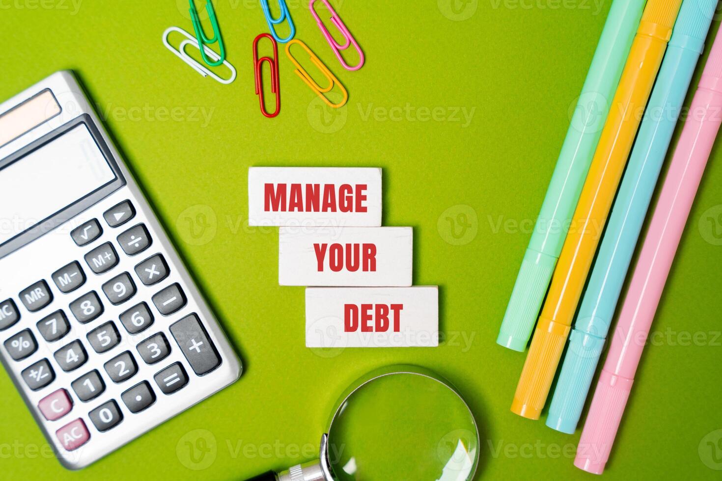 Manage your debt concept. Strategically vision and repaying borrowed money to maintain financial stability and avoid excessive interest or penalties. Inscription on the blocks. Business and finance photo