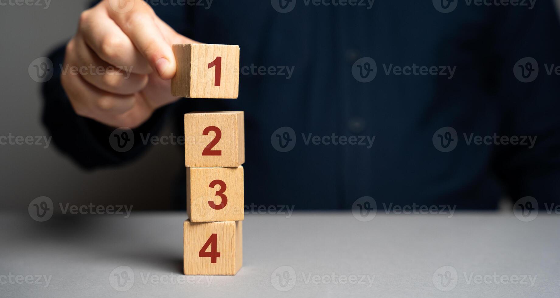 Businessman puts wooden blocks with the number 1 2 3 4. Task list. Alternate items and conditions for implementation. Organization and systematization, step by step instructions. photo