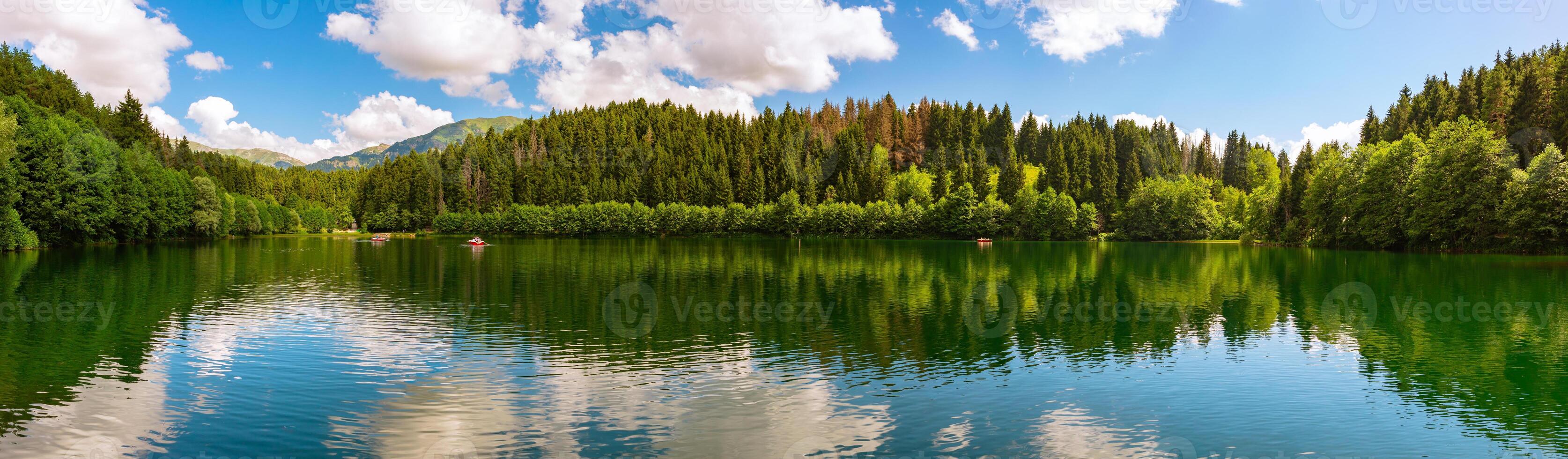 Panoramic view of Karagol Lake and forest. Landscape of a lake photo