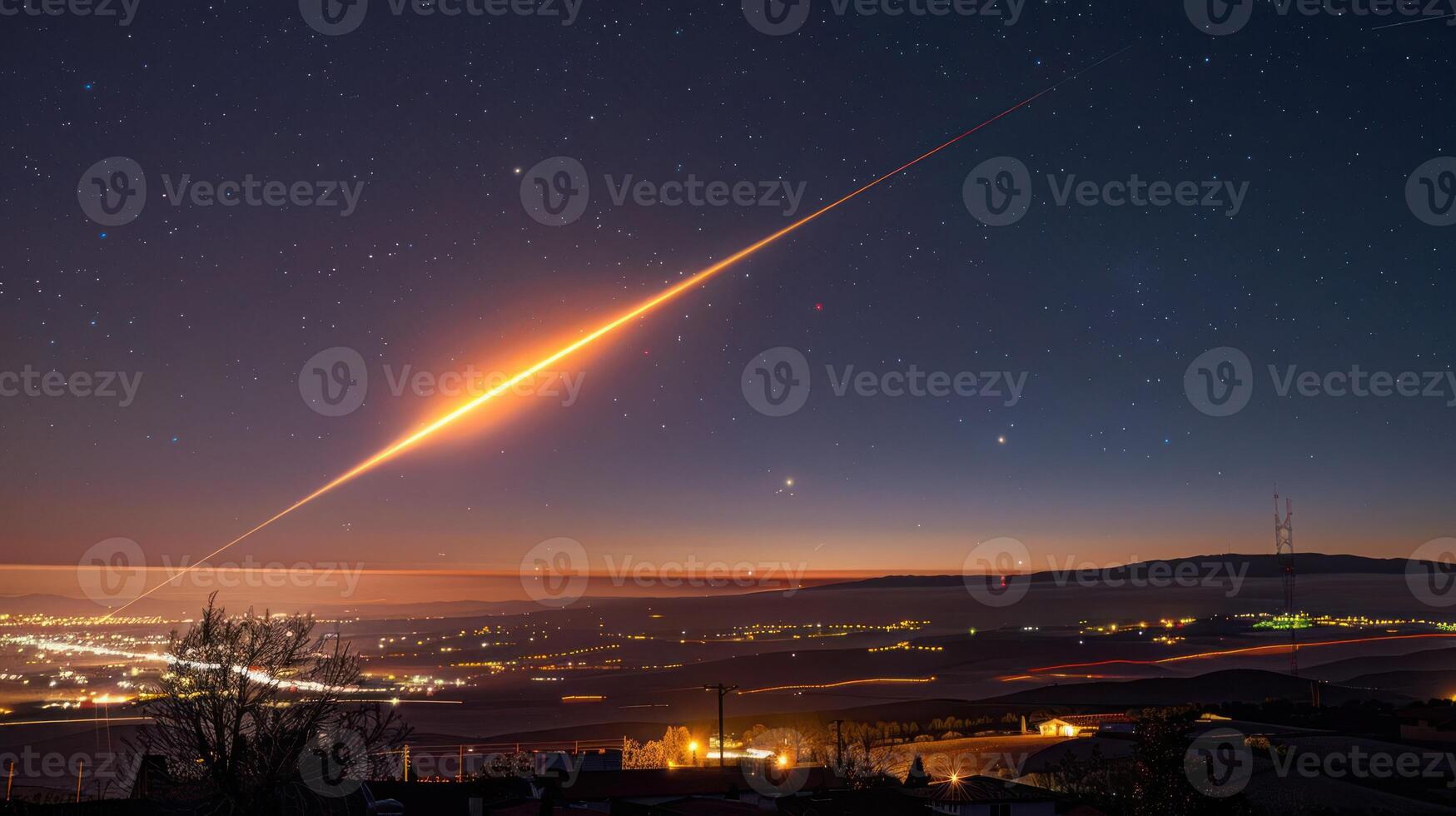 Bright meteor streaks across a starry night sky above a tranquil countryside landscape photo
