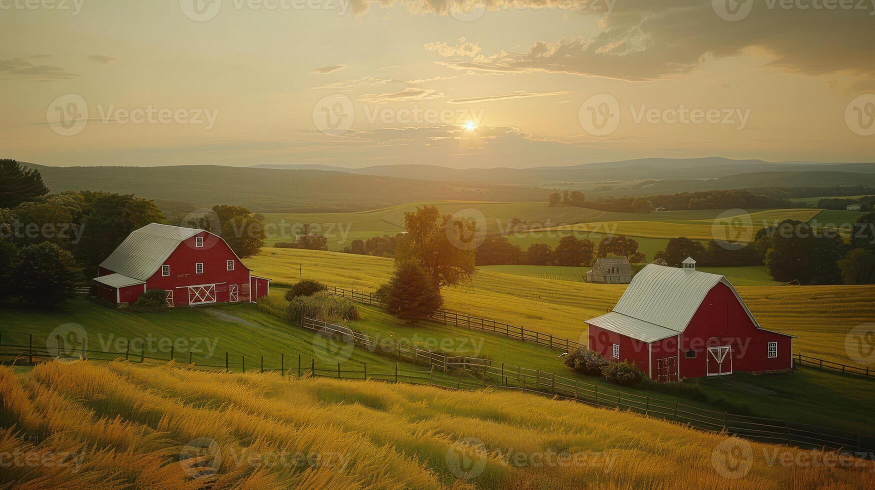 Scenic sunset over red barns in a lush green landscape with rolling hills and golden fields photo