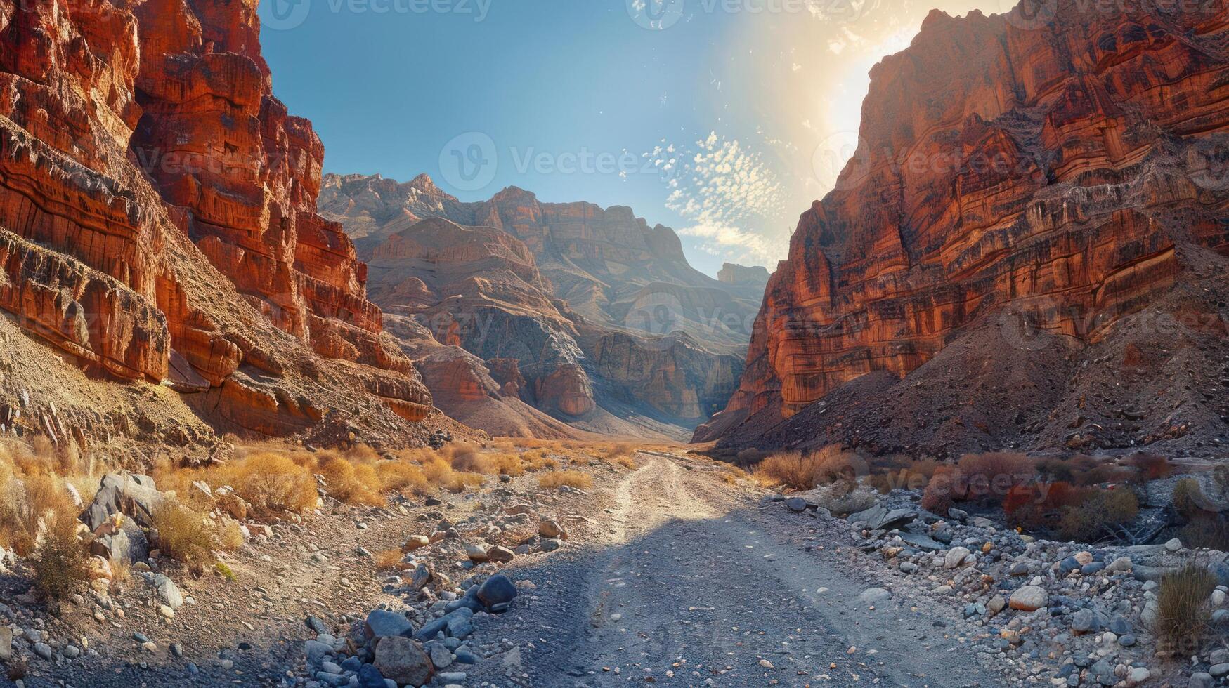Vibrant canyon landscape with rocky terrain, sunlight casting shadows, and serene atmosphere photo