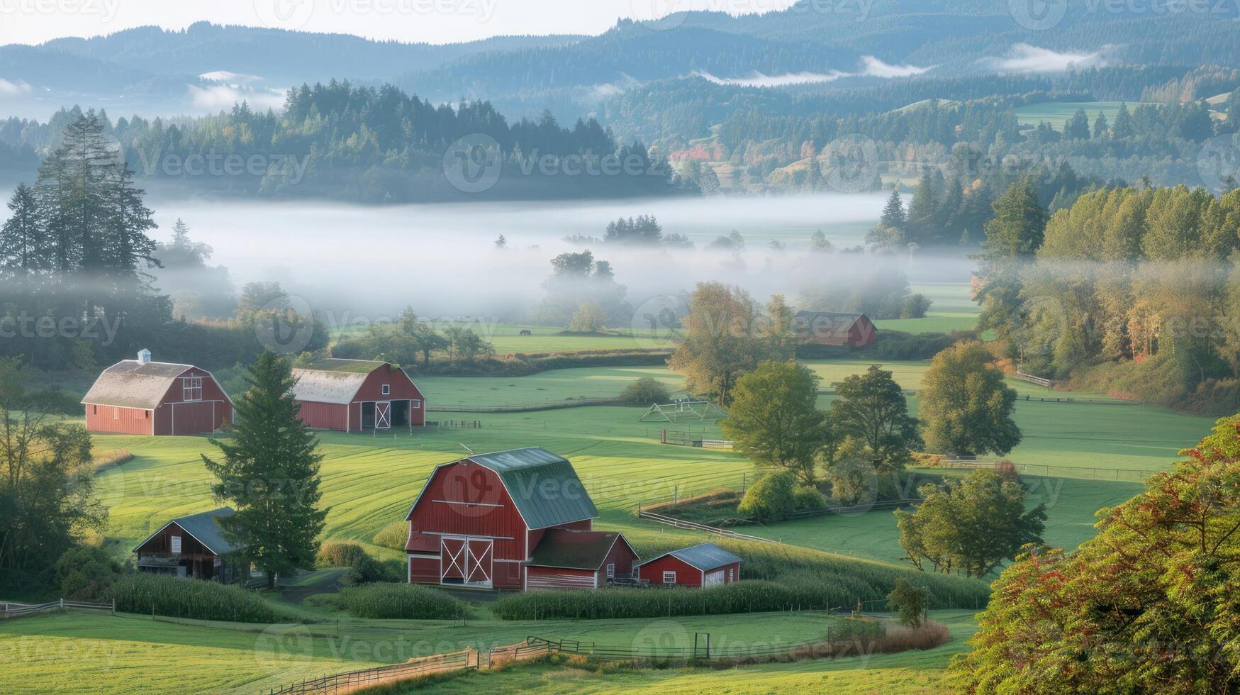 Serene rural landscape featuring red barns amidst lush green fields and morning fog photo