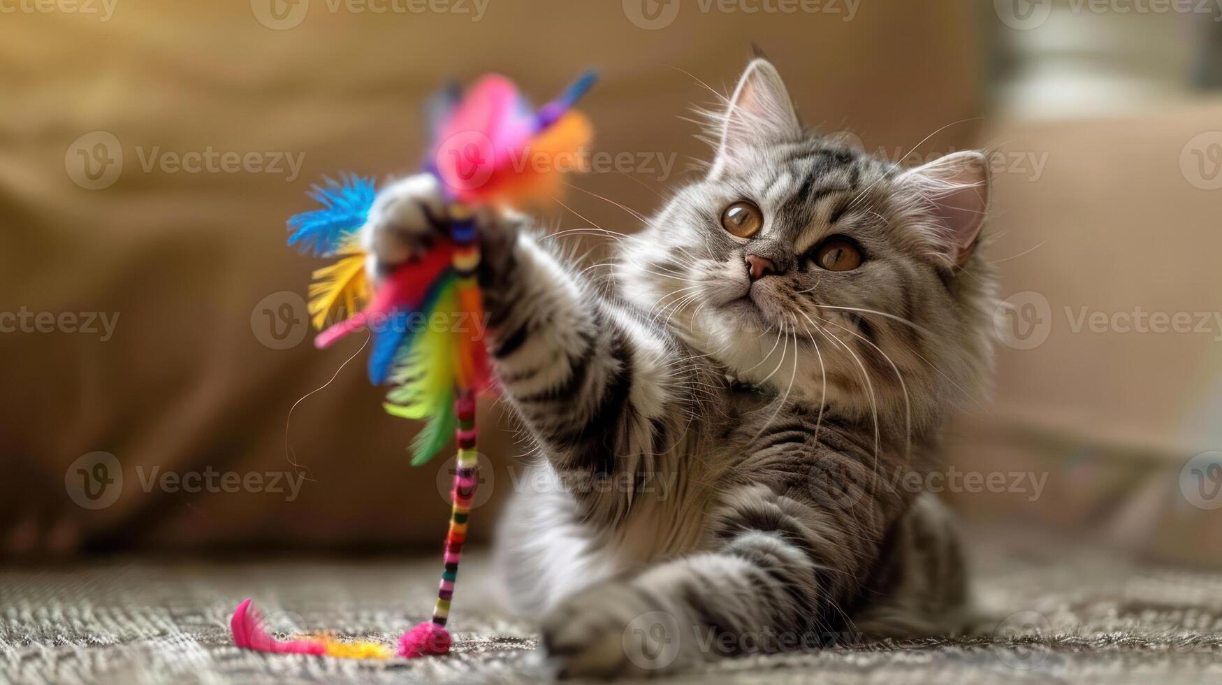 Playful cat engaging with colorful feather toy in cozy indoor setting, showcasing joy and curiosity photo