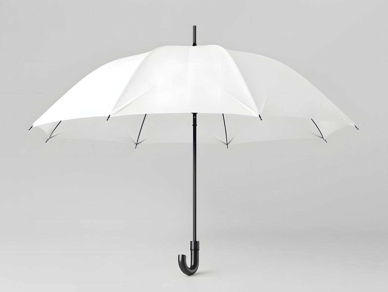 An open white umbrella on a gray background photo