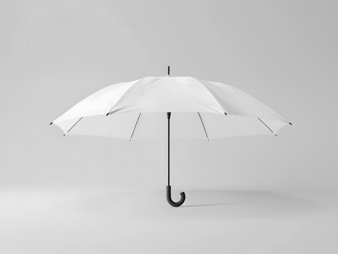 An open white umbrella on a gray background photo